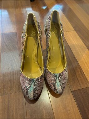 BCBGeneration pumps featuring a multicolored snake print pattern.